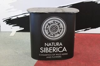 Exhibition table with Natura Siberica logo